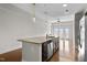 Open concept kitchen with stainless steel appliances, granite island and hardwood floors at 222 Glenwood Ave # 714, Raleigh, NC 27603