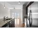 Bright kitchen with stainless steel appliances, granite counters, and access to a balcony at 222 Glenwood Ave # 714, Raleigh, NC 27603