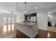 Modern kitchen features an island, stainless steel appliances, dark cabinetry and an open floorplan at 222 Glenwood Ave # 714, Raleigh, NC 27603