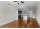 A spacious living room with hardwood floors, an open floor plan, and a view into the modern kitchen at 222 Glenwood Ave # 714, Raleigh, NC 27603