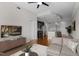 Open concept living room with hardwood floors, modern lighting, and view of kitchen at 222 Glenwood Ave # 714, Raleigh, NC 27603