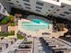 Aerial view of rectangular pool surrounded by lounge chairs and lush landscaping at 222 Glenwood Ave # 714, Raleigh, NC 27603