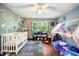 bedroom featuring two beds, a stylish rug, and a window with natural lighting at 24 Sunrise Pl, Durham, NC 27705