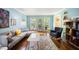 Bright living room with hardwood floors, comfortable seating, a large window and stylish decor at 24 Sunrise Pl, Durham, NC 27705