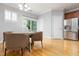Dining area boasts hardwood floors, a modern chandelier, and sliding glass doors leading to the outside at 2609 Stewart Pines Dr, Raleigh, NC 27615