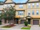 Inviting townhome exterior with a well-maintained lawn and tasteful landscaping showcasing the architecture at 2609 Stewart Pines Dr, Raleigh, NC 27615