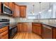 The kitchen showcases stainless steel appliances, granite countertops, and stylish wood cabinetry at 2609 Stewart Pines Dr, Raleigh, NC 27615