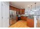 Updated kitchen with stainless steel appliances, granite countertops, and hardwood floors offer a modern touch at 2609 Stewart Pines Dr, Raleigh, NC 27615