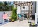 Inviting backyard patio area with a pergola, hammock, and quaint seating arrangement at 2805 Fayetteville St, Durham, NC 27707