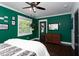 Bedroom showcases modern decor, a ceiling fan, and ample natural light at 2805 Fayetteville St, Durham, NC 27707