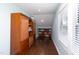 Long hallway with built-in shelving and storage cabinets at 2805 Fayetteville St, Durham, NC 27707