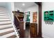 Hallway leading to a bedroom with a view of stairs at 2805 Fayetteville St, Durham, NC 27707