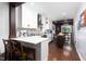 Open-concept kitchen with island, bar seating, and dining area at 2805 Fayetteville St, Durham, NC 27707
