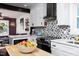 Updated kitchen featuring white cabinetry, stainless appliances at 2805 Fayetteville St, Durham, NC 27707