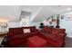 Inviting living room with plush sofas, skylights, and a home office area at 2805 Fayetteville St, Durham, NC 27707