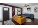 Cozy living room with hardwood floors, eclectic decor, and a blend of modern and vintage furnishings at 2805 Fayetteville St, Durham, NC 27707