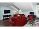 Spacious living room features a large TV, comfortable seating, and a desk area at 2805 Fayetteville St, Durham, NC 27707