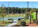 Well-maintained athletic fields offering a basketball court, benches, and lush green spaces for outdoor activities at 2837 Milano Ave, Apex, NC 27502
