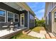 The home's backyard features green grass, a patio, siding, and an outdoor table at 2837 Milano Ave, Apex, NC 27502