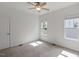 An empty bedroom featuring neutral walls, carpeted floors, and natural light from the window at 2837 Milano Ave, Apex, NC 27502