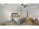 Relaxing bedroom with a ceiling fan, neutral tones, and an ensuite bathroom at 2837 Milano Ave, Apex, NC 27502