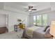 Bright bedroom featuring a ceiling fan, neutral walls, a workspace, and natural light from the window at 2837 Milano Ave, Apex, NC 27502