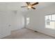 Empty bedroom with neutral walls, carpeted floors, a ceiling fan, and natural light at 2837 Milano Ave, Apex, NC 27502