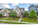 Inviting home featuring a manicured lawn, brick stairway and inviting front porch in a friendly neighborhood at 2837 Milano Ave, Apex, NC 27502
