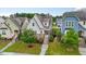 Charming home featuring neutral siding, brick accents, and a welcoming front porch and manicured landscaping at 2837 Milano Ave, Apex, NC 27502