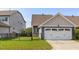 Charming home with a two-car garage, well-maintained lawn, and inviting curb appeal at 2837 Milano Ave, Apex, NC 27502