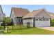 Charming home with a two-car garage, well-maintained lawn, and an inviting outdoor patio at 2837 Milano Ave, Apex, NC 27502