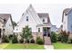 Inviting curb appeal with brick accents, a well-manicured lawn, and a classic entrance to welcome you home at 2837 Milano Ave, Apex, NC 27502