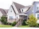 Charming home exterior with brick accents, landscaped yard, and inviting front porch at 2837 Milano Ave, Apex, NC 27502