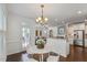 Open floor plan connecting dining area with stainless steel appliances at 2837 Milano Ave, Apex, NC 27502