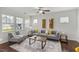 Bright living room with large windows and stylish decor at 2837 Milano Ave, Apex, NC 27502