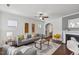 Inviting living room with hardwood floors, neutral colors, and fireplace at 2837 Milano Ave, Apex, NC 27502