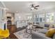 Open-concept living space with fireplace, eat-in kitchen, and modern furnishings at 2837 Milano Ave, Apex, NC 27502