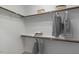Walk-in closet with built-in shelving, hanging rods, and ample storage space for clothes and accessories at 2837 Milano Ave, Apex, NC 27502