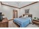 Well-lit bedroom featuring a wooden bed frame, ceiling fan, and views to the outdoors at 289 Stoneview, Pittsboro, NC 27312