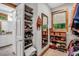 Walk-in closet with built-in shelving, ample storage and natural light at 289 Stoneview, Pittsboro, NC 27312