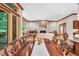 Open floor plan with dining, kitchen, and living areas featuring hardwood floors and natural light at 289 Stoneview, Pittsboro, NC 27312