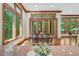 Bright dining area with hardwood floors and large windows overlooking lush backyard scenery at 289 Stoneview, Pittsboro, NC 27312