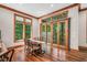 Dining room featuring wood trim, hardwood floors, large windows and sliding doors to the exterior at 289 Stoneview, Pittsboro, NC 27312