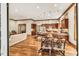 Open floor plan with kitchen, dining, and living areas featuring hardwood floors and natural light at 289 Stoneview, Pittsboro, NC 27312