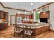 Large kitchen featuring wood cabinets, granite countertops, stainless steel appliances, and hardwood floors at 289 Stoneview, Pittsboro, NC 27312