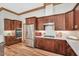 Kitchen features dark wood cabinets and stainless steel appliances at 289 Stoneview, Pittsboro, NC 27312