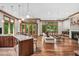 Open concept living room with a fireplace, bar counter, and natural light at 289 Stoneview, Pittsboro, NC 27312