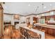 Open floor plan with kitchen, dining, and living areas featuring hardwood floors and natural light at 289 Stoneview, Pittsboro, NC 27312