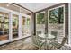 Inviting screened porch with tile flooring, serene views and comfortable seating at 289 Stoneview, Pittsboro, NC 27312