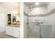 Bathroom featuring a glass-enclosed shower with tiled walls, a granite vanity, and modern fixtures at 3 Bent Oak Ct, Durham, NC 27705